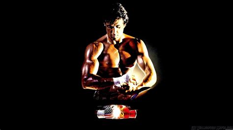 Download Rocky Balboa Holding Boxing Gloves Wallpaper | Wallpapers.com