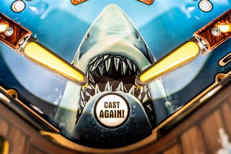 New JAWS Pinball Machine from Stern Has Original Movie Footage, Shark Toys, and Lots of Blood