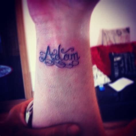 Name Adam tattoo wrist