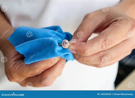 Jeweller Hand Polishing and Cleaning Jewelry Diamond Ring Stock Image ...