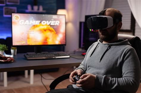 Premium Photo | Man playing video games on computer using vr glasses. gamer with virtual reality ...