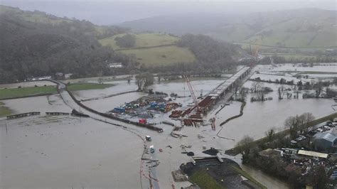 Wales weather: Machynlleth bridge closed as cars rescued from floods ...