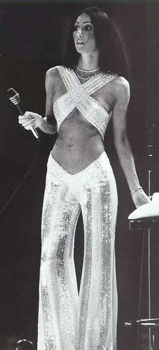 Cher, 1970s. White and sequin bell bottom pants with a criss cross top. | Fashion, Fashion 70s ...