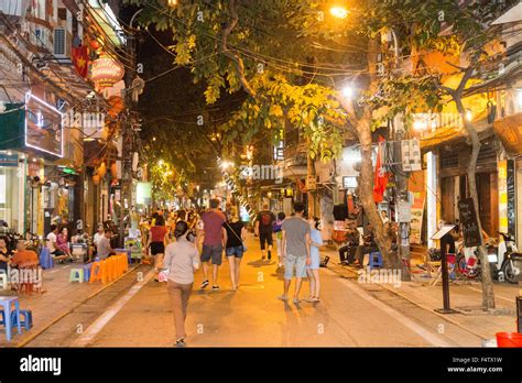 street scene at night from Hanoi old quarter in the city centre of ...