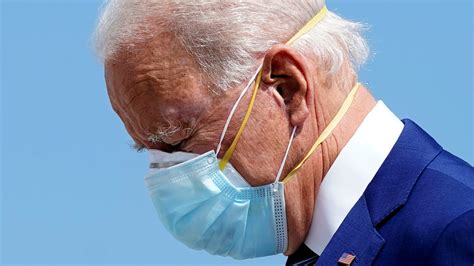 Joe Biden, guarding against COVID-19, is wearing two face masks