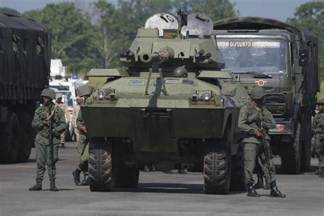 Venezuelan soldiers take part in a military exercise at the Garcia ...