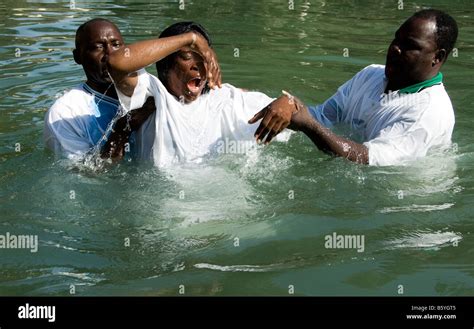 Baptism in the Jordan River Stock Photo - Alamy