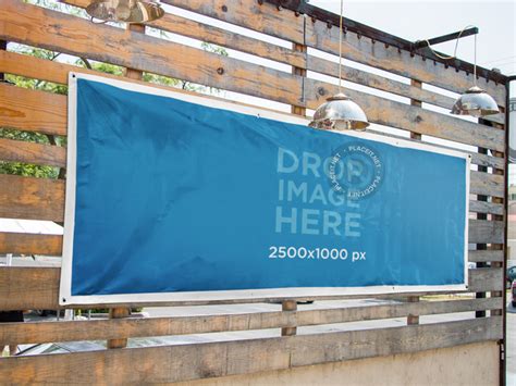 Placeit - Horizontal Banner Mockup Nailed to a Wooden Wall