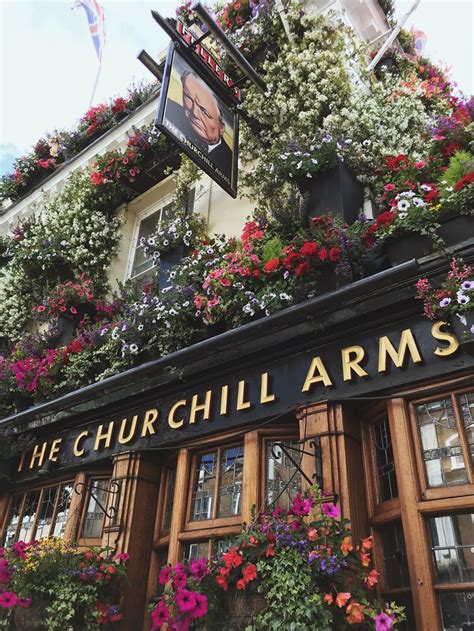 A close up of The Churchill Arms pub in London. Definitely stop by for ...