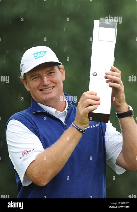 South African golf pro Ernie Els holds the winner's trophy during the ...