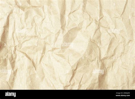 Light brown crumpled kraft paper texture, background Stock Photo - Alamy