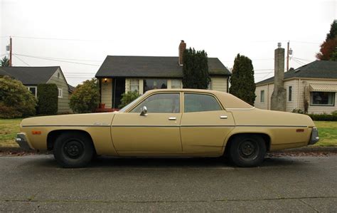 OLD PARKED CARS.: 1974 Plymouth Satellite Custom.