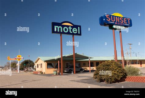 Moriarty, New Mexico - February 2, 2019: Colorful signs of the sunset motel on historic route 66 ...