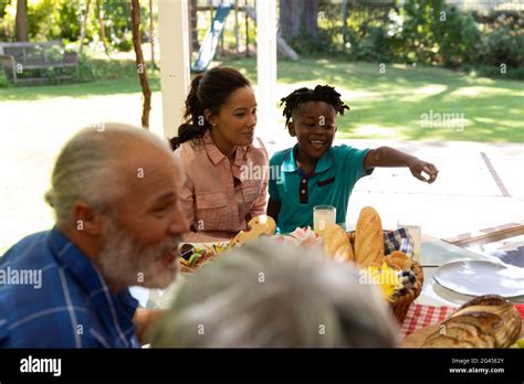 Family eating together at table Stock Photo - Alamy