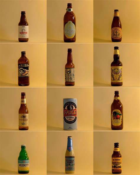 many different types of beer bottles lined up on a wall with the same ...