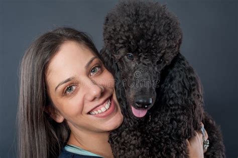 Portrait of a Beautiful Young Woman Hugging Her Beautiful Dog Stock ...