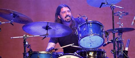 Dave Grohl Explains Why It's 'Practically Impossible' To Drum And Sing