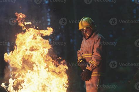 Firefighter in action 11588876 Stock Photo at Vecteezy