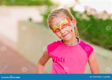 Happy Little Girl with Face Art Paint in the Park. Stock Photo - Image of closeup, beauty: 114274746