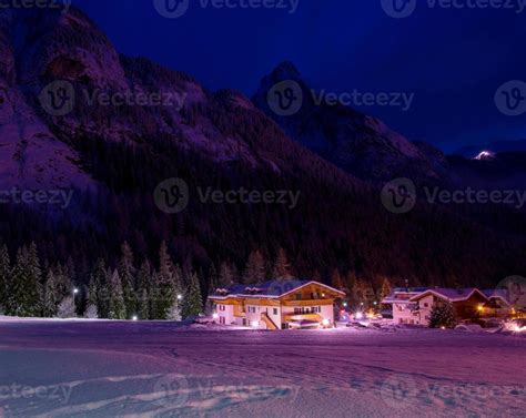 mountain village in alps at night 10767055 Stock Photo at Vecteezy