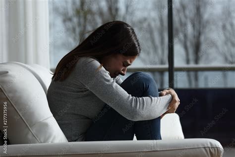 Sad girl crying and complaining alone at home Stock Photo | Adobe Stock