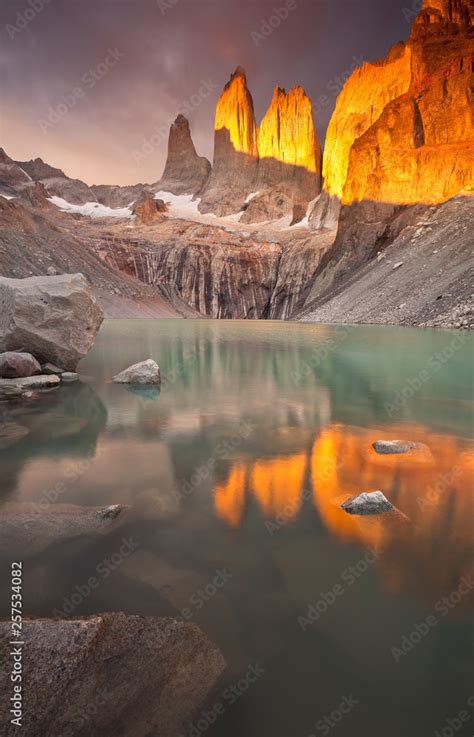 Sunrise on Torres del Paine's iconic towers. Stock Photo | Adobe Stock