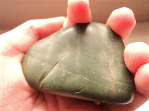 What's this dark-green rock? It's smooth with a plastic texture. Has ...