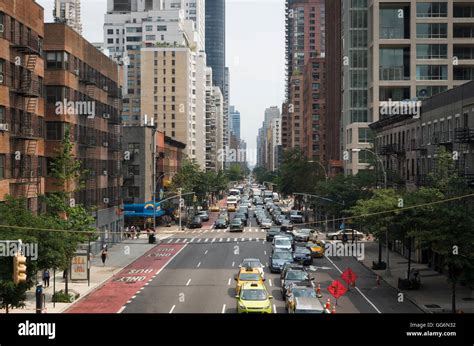 View along 2nd Avenue, New York City, with traffic and skyscraper ...