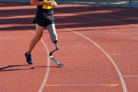 Man with Prosthetic Leg Running at a Stadium Stock Photo - Image of disabled, amputated: 171258716