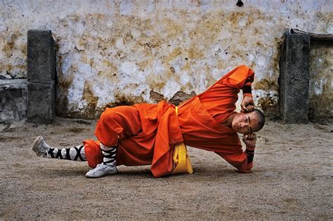 Young monk practicing Shaolin, one of the oldest styles of Kung Fu, Shaolin Monastery, Henan ...