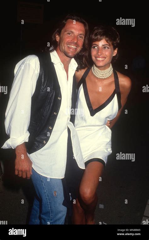 LOS ANGELES, CA - AUGUST 18: (L-R) Actor Roger Wilson and model Christy ...