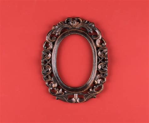 Premium Photo | Artistic picture oval frame isolated on red background