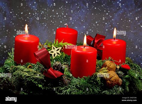 . advent wreath with 3 burning candles Stock Photo - Alamy