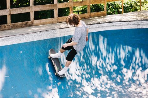 Free Photo | Extreme skateboarder riding on ramp