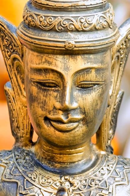 Premium Photo | Golden buddha sculpture toned