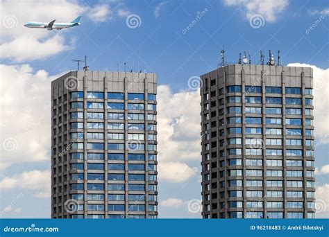 Modern Glass and Concrete Skyscrapers and a Plane in the Sky Stock Image - Image of architecture ...