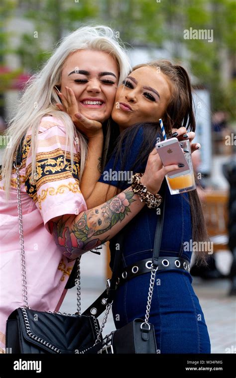 Dundee, Tayside, Scotland, UK. 12th July, 2019. UK weather: Two female friends standing hugging ...