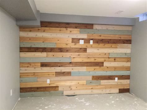 Basement wall finished with cedar boards and different finishes ...