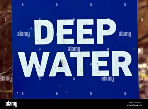 Sign warning of deep water Stock Photo - Alamy