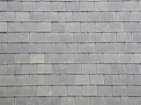 This image of a slate roof has a tiled, or shingled pattern of ...