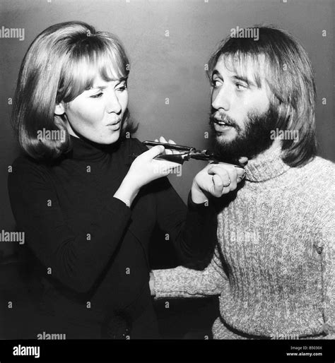 Lulu singer giving husband Maurice Gibb of the Bee Gees a shave Stock ...