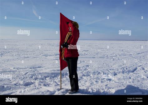 Happy girl with a red flag Stock Photo - Alamy