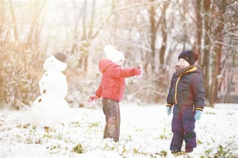 Premium Photo | Children in winter park play