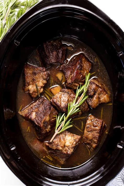 Slow Cooker Beef Short Ribs are cooked in the crockpot until they reach fall-off-the-bone ...