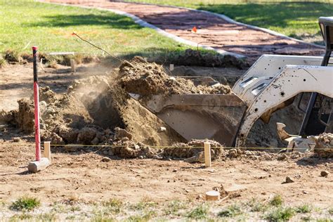 Small Bulldozer Digging In Yard For Pool Installation 16359391 Stock ...