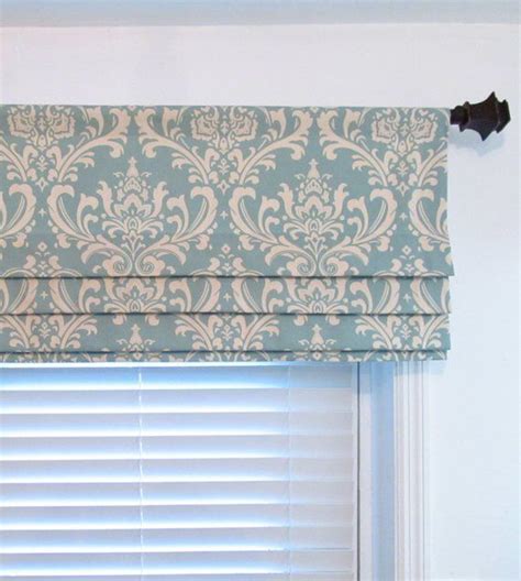 Beautiful damask pattern. Colors include dusty blue and natural. Valance is lined with white ...