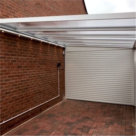 Carport with Roller Garage Door: Bever, Worcester - SBI Ltd