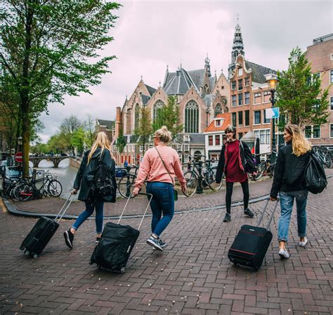 Tourists Arriving in Amsterdam - Travel Off Path