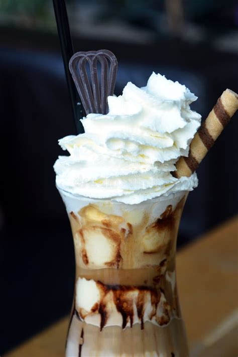 Delicious Iced Coffee with Whipped Cream on a Glass Cup. Stock Image ...