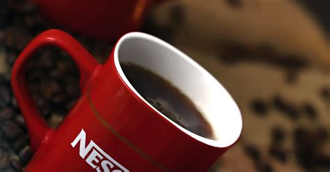 White and Red Nescafe Ceramic Coffee Mug With Coffee · Free Stock Photo